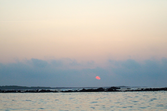 Sunrise over outer Puerto Villamil harbor