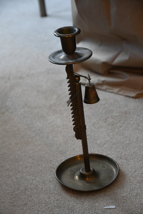 Ratcheting brass candlestick