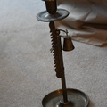 Ratcheting brass candlestick